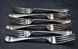 A group of six George V silver Old English pattern table forks, with pip to terminal and engraved