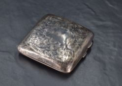 A George V silver cigarette case of hinged rectangular form and curved for the gentleman's pocket