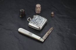 An Edwardian silver vesta case, of traditional design with engraved ivy leaf decoration and