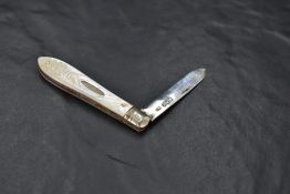 A George V silver bladed and Mother-of-Pearl handled pocket knife, the Mother-of-Pearl mounts with