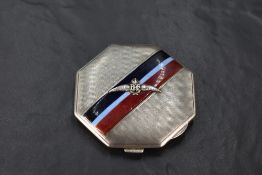 A George VI silver military interest powder compact, of octagonal for, with engine-turned surface