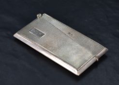 A George V silver visiting card case, of hinged rectangular form with engine-turned decoration and