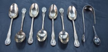 A group of seven George V silver coffee spoons, with oval bowls and moulded terminals, marks for