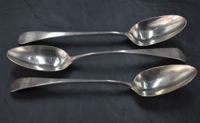 A group of three Georgian silver table spoons, Old English pattern with pip reverse, two engraved