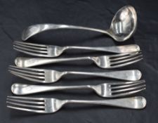 A group of five George V silver Old English pattern forks, with pip to terminal and engraved with