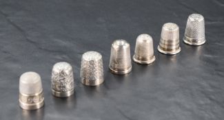 A group of six silver thimbles, each of traditional form, gross weight 25grams sold along with two