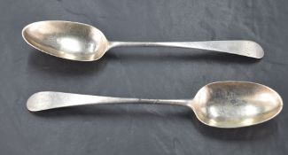 A pair of George III silver Old English pattern table spoons, engraved with initials WJD with pip