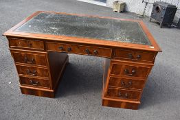 A reproduction yew wood pedestal desk, approx. dimensions 140 x 78cm
