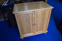 A modern light oak TV cabinet/desk unit, approx dimensions W69cm D52cm H85cm