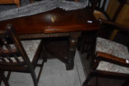 A vintage Priory style drawer leaf dining table and eight (six plus two) dining chairs