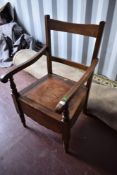 A late 19th Century stained frame commode carver chair