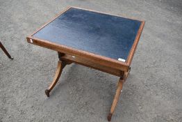 A stained frame coffee table having blue leather top and Regency style frame