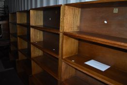 A run of four vintage Simplex stacking bookshelves, each having four tiers over deep base, width