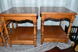 A pair of modern yew effect side tables having under tier with drawer