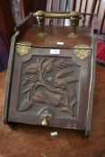 A Victorian mahogany coal purdonium having pokerwork and carved bird decoration