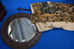 A late 19th or early 20th Century varved oak circular wall mirror , wrought iron curtain pole and