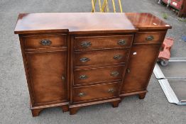 A reproduction Regency yew breakfront sideboard of small proportions, width approx.110cm