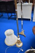 Two vintage standard lamps including brass and ormulu effect and three shades
