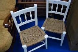 A pair of 19th Century painted childs spindle back chairs