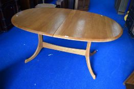 A modern Ercol or Parker Knoll style extending, whale-tail style legs, oval table, 100cm wide x
