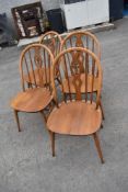 A set of four Ercol hoop and stick chairs with fleur de lys style backs