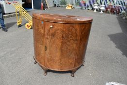 An early 20th Century walnut bow fronted side cabinet, width approx. 109cm