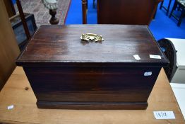 An antique stained pine storage box of small proportions