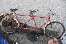 A vintage tandem bicycle, with BSA badge to frame