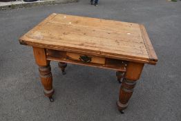 A 19th Century and later drawer leaf dining table