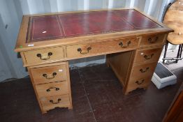 A reproduction Regency pedestal desk, light colour