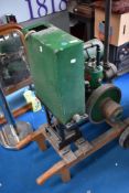 A vintage stationary engine, Stuart, with water boiler and mounted on trolley