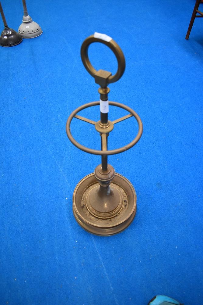 A vintage brass stick stand