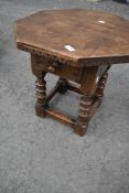 A good quality reproduction oak octagonal table with frieze drawer, possibly Titchmarsh and Goodwin
