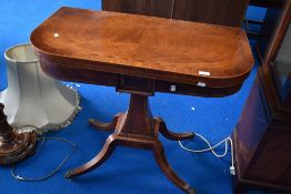 A reproduction Regency yew wood fold over card table having quatrefoil base