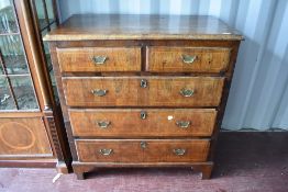 A 19th Century walnut/mahogany chest of two over three drawers having brass drop handles and bracket