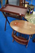 A butlers tray on stand and a modern oak effect magazine table
