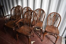 A set of six (four plus two) vintage dark stained Windsor style dining chairs having crinoline