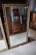 A gilt framed wall mirror, approx 133 x 71cm