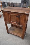 A period oak side or hall cabinet with single cupboard over pot shelf, width approx 75cm, height