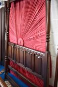A reproduction four poster bed, drapes etc
