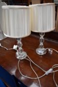 A pair of modern glass table lamps