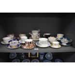 A mixed lot of antique and vintage cups and saucers, including Royal Crown Derby in Imari colour