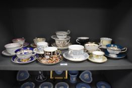 A mixed lot of antique and vintage cups and saucers, including Royal Crown Derby in Imari colour