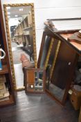 two mirrors, a vintage oak framed example and a gilt framed hall mirror.