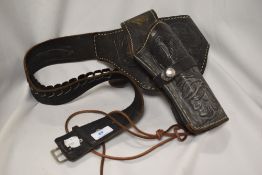 A vintage embossed Mexican style leather holster.