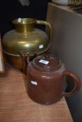 A 20th century large Eastern brass jug/ receptacle with handle, having embossed detailing.