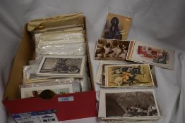 A collection of vintage and antique postcards, predominantly of dog interest.