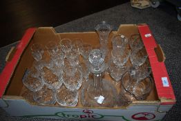 A collection of cut glass wine glasses, liquor glasses, jug, decanter and vase, including Bohemia