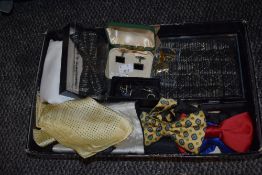 A collection of retro bow ties, cuff links and accessories.