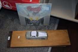 A vintage wooden printing block tray, a LP record 'Brazil' and a vintage tin toy car.